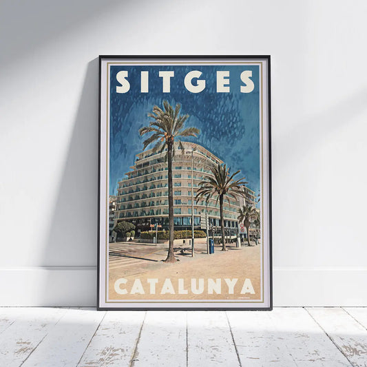 Passeig Marítim Poster Sitges by Alecse displayed in a black frame featuring the Calipolis Hotel, palm trees and Sitges seafront, limited edition travel poster