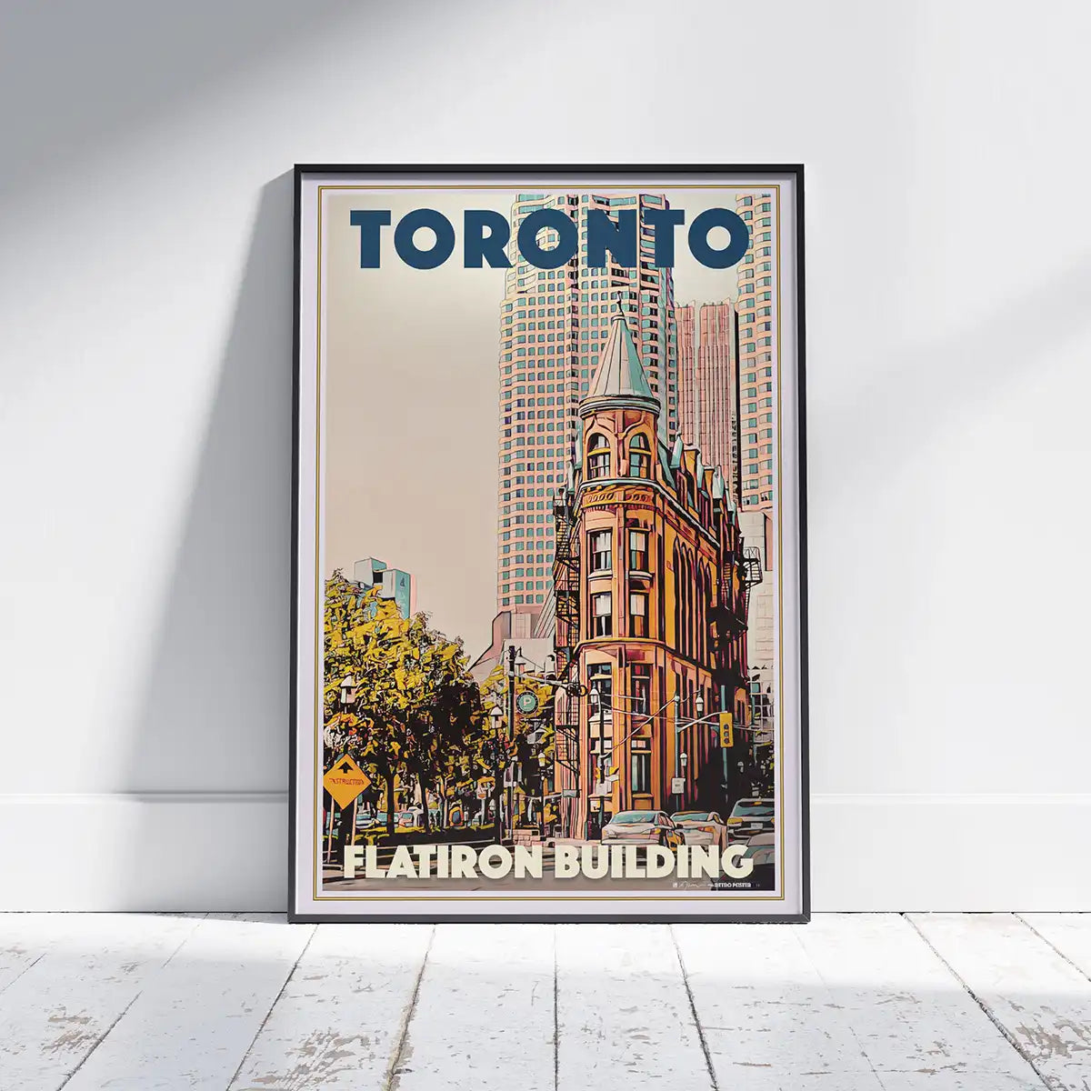 Framed Toronto Flatiron Building vintage poster displayed in a minimalist interior, architectural wall art by Alecse