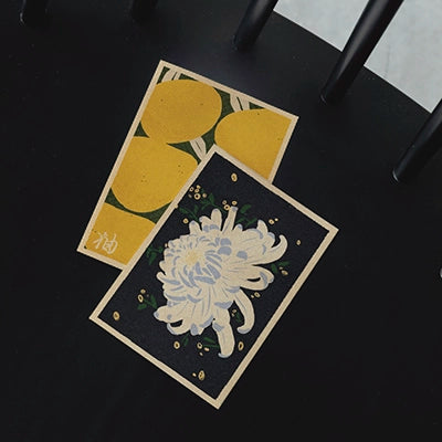 Japanese-inspired posters from the Vintage Exotics™ collection by Cha, with retro pop illustrations of a flower and yuzu