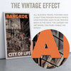 Macro view of Alecse's 'City of Life' poster, revealing the half-tone render of Bangkok's lively street scene