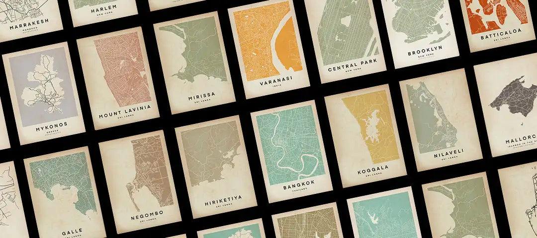 Grid of vintage-style map posters by The Wanderer Maps™ on a black background