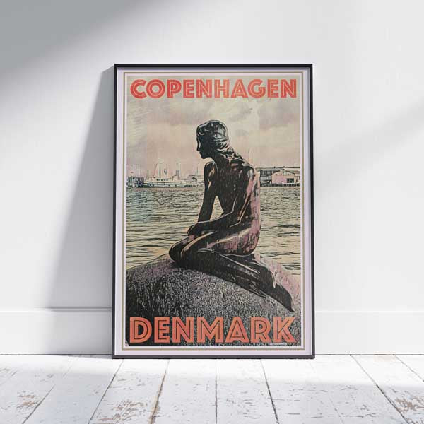 Copenhagen Little Mermaid Poster framed on a white wooden floor showcasing Danish travel allure