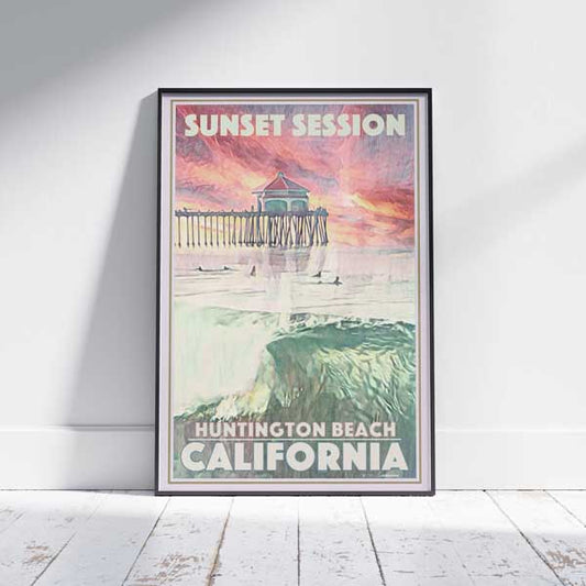 Huntington Beach Sunset travel poster in a frame on a white wooden floor