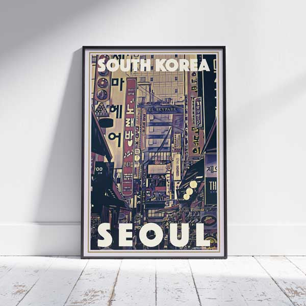 Poster Displayed on the Floor – The framed Seoul city poster, leaning against a wall, showcasing a dynamic street scene with colorful neon signs, representative of Seoul’s vibrant nightlife